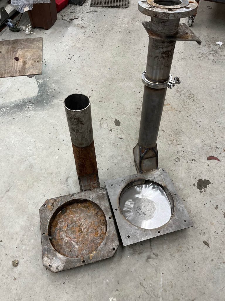 old, rusted, broken pump housing replaced by new stainless steel custom fabricated housing