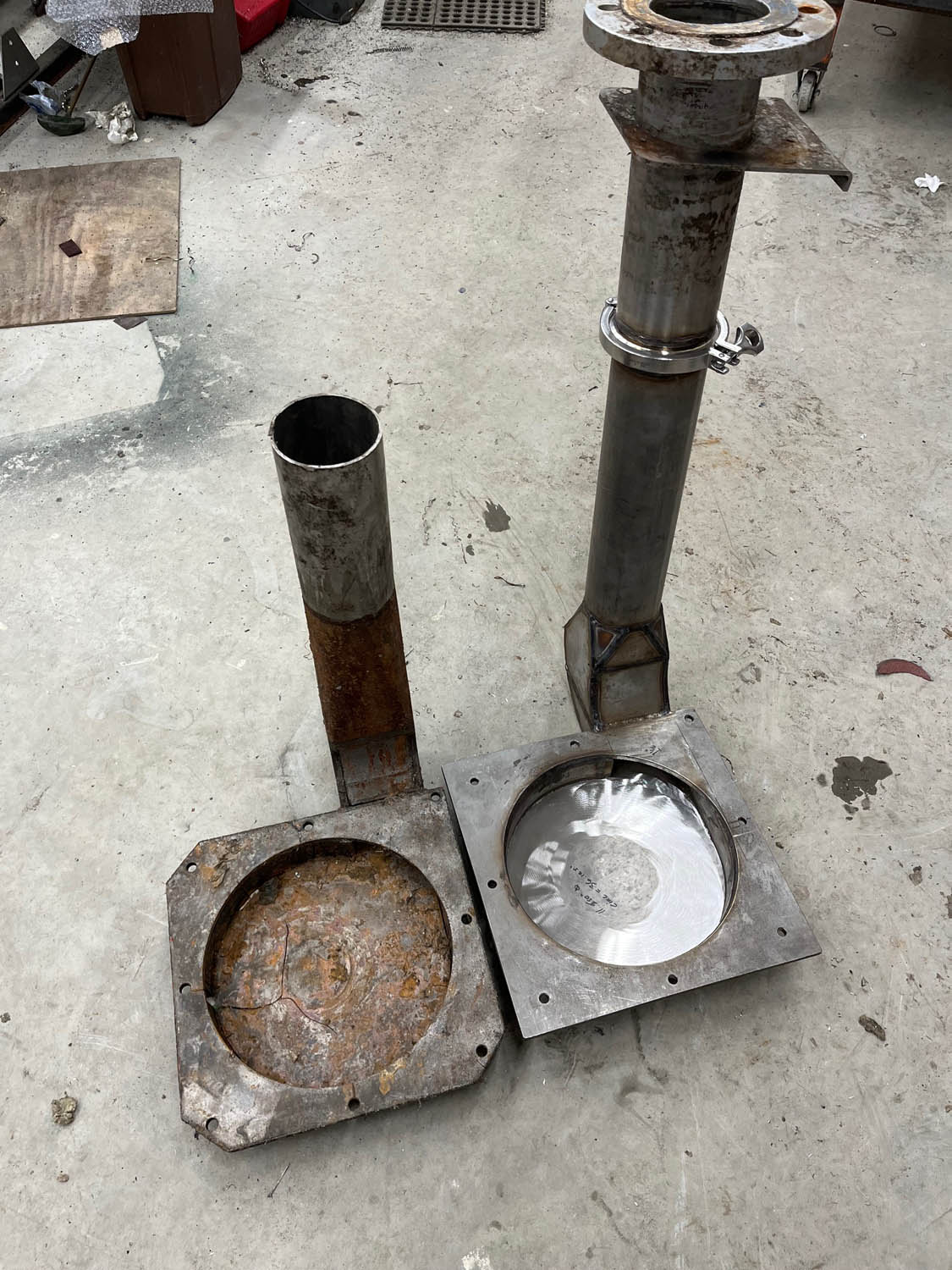 old, rusted, broken pump housing replaced by new stainless steel custom fabricated housing